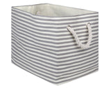 Gray &amp; white striped storage bin

This large storage bin is an ideal solution for your home organization needs. Its elegant pinstripe design adds a touch of sophistication to any room, while its generous size ensures ample storage.&nbsp;

Materials:
Paper, fabric, rope

Dimensions:
12" high x 12" deep x 17" wide
