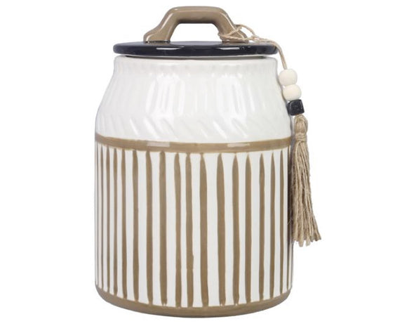 Decorative storage jar with striped pattern and tassel on a white background