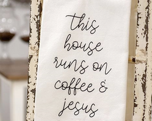 White kitchen dish towel

Add charm to your kitchen with this white cotton dish towel. It comes with a hanging loop in one corner for easy hanging on hooks and knobs. The towel reads, "This house runs on coffee &amp; Jesus" in black script. This towel makes for a great housewarming gift.

Dimensions:
Cotton

Dimensions:
28" high x 28" long