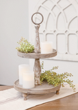 Weathered vintage style wooden tiered tray

This freestanding tiered tray features three wooden legs, two wooden tray tiers, and two distressed beams for support. The tray features a weathered finish with bits of faded white paint. It is perfect for displaying decorative fruit, fillers, and other decorative accessories.&nbsp;

Materials:
Wood

Dimensions:
12" diameter x 21" high