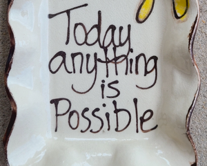 Small 'Today Anything Is Possible' hand-painted plate

Serve up small appetizers or make a treat for yourself with this charming rectangular plate. Made of stoneware and food safe, it features the phrase "Today anything is possible" below a whimsical sun. The edges of the plate are ruffled to give this piece even more character.&nbsp;

This item is proudly made by Kim Ries in the USA.

Materials:
Stoneware

Dimensions:
4" wide x 1/2" deep x 7" long