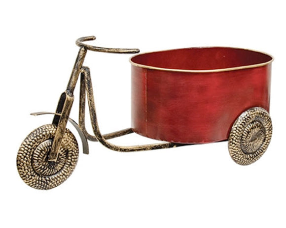 Decorative planter shaped like a red bicycle with gold accents on a white background
