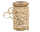 This unique decorative accent is perfect for year-round display in your craft room. The piece features a wooden spool with a dark, distressed finish wrapped in jute twine. A small pair of rusted antique scissors is tied to the end of the twine. Due to the genuine antique nature of this item, appearance may vary slightly.

Materials:
Wood, metal, jute

Dimensions:
2" diameter x 3 1/2" high