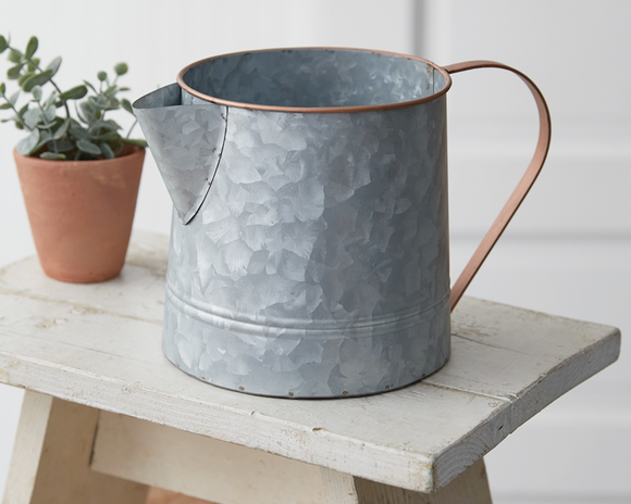 Two-tone metal pitcher vase

Bring an instant touch of farmhouse decor to a table when incorporating our galvanized pitcher. This item is made of metal and holds dried flowers, utensils, and more. It is not food safe and is not guaranteed to be watertight.

Materials:
Metal

Dimensions:
6