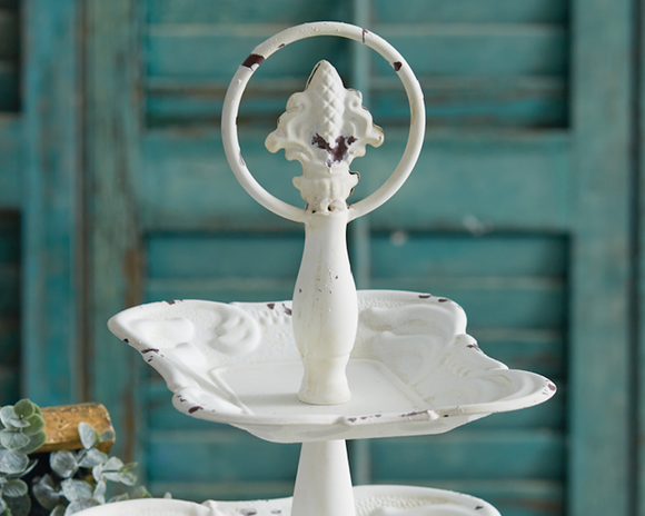 Two-tiered distressed white metal tray

Capture the essence of French country decor with detailed flourishes and keep tabletops organized at the same time with this item's two tiers. Gather trinkets, rings, or cotton balls in a bathroom or on a vanity table for beautiful look.

Materials:
Metal

Dimensions:
10 1/2