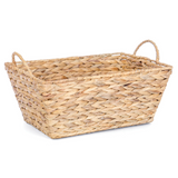 Woven basket with handles on a white background