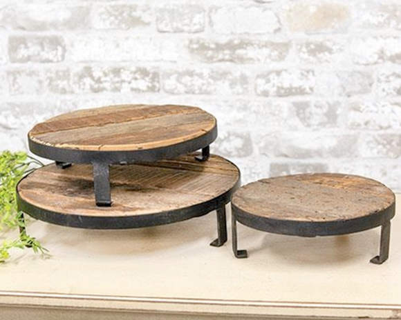 This collection of risers is perfect for any country decor. Each riser features recycled wood set on a raised metal base that is perfect for displaying potted florals, candles, primitive dolls, and framed pictures. It can also be used to display wrapped foods and treats. The possibilities are endless!