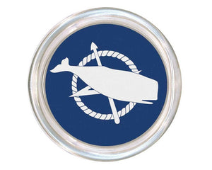 Round badge with a white whale and anchor design on a blue background