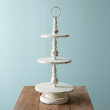 Ornate distressed creamy white tiered tray

Display desserts for a wedding or small items for your store on this feminine display stand. It features a loop to carry and is a large piece measuring almost 3 feet tall. It is made of metal and not food safe. It is recommended to use with dollies or liners.

Materials:
Metal

Dimensions:
14" diameter x 33" high