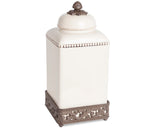 Decorative white jar with a bronze base and lid on a white background