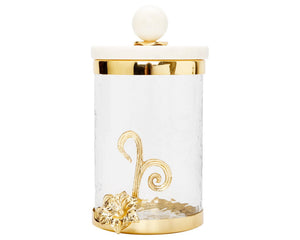 Decorative cookie jar with gold accents on a white background