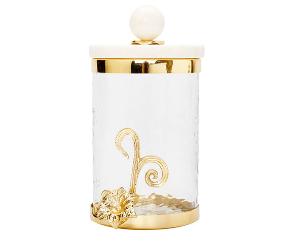 Decorative cookie jar with gold accents on a white background