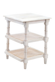 White side table with rattan shelves on a white background