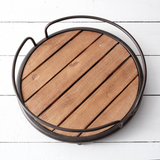 Rustic farmhouse round wood plank serving tray

Add rustic style to a dining room server or bathroom counter with this lovely tray. It features a plank wood base and metal accents. Its size makes it perfect for carrying small dishes. This tray is a great choice as a housewarming gift.

Materials:
Wood, metal

Dimensions:
4" high x 14 1/2" diameter