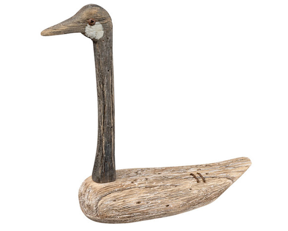 Driftwood sculpture of a goose on a white background