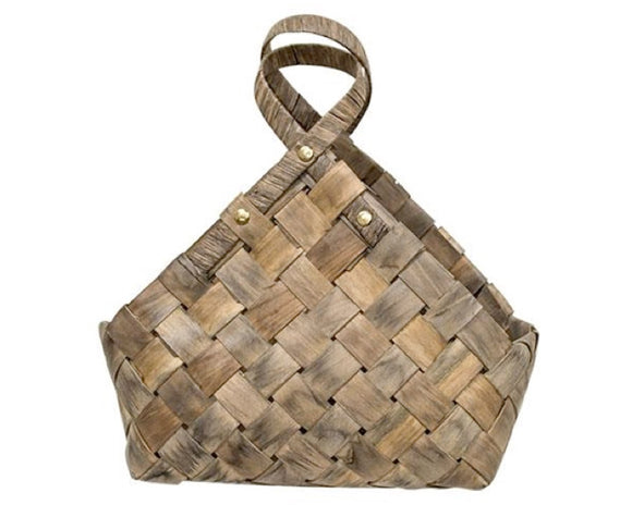 Rustic woven gathering basket

This rustic basket is made of woven wood strips. The basket has a pair of loop handles with gold rivet details that complete the look. This piece looks great displayed on a table, or hung from a hook to organize mail or takeout menus.

Materials:
Wood, metal

Dimensions:
9