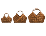 Three woven brown handbags of different sizes on a white background