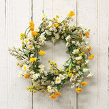 This candle ring is a decorative floral piece with a green-wrapped base. It is perfect to use as a candle ring around a larger pillar candle or as a miniature wreath. The ring as soft, foamy greenery and features cream and yellow astilbe buds alongside layered cream and yellow blooms. This ring brings a bright and cheerful touch to the home during the spring and seasons. They would also work well as wedding decorations.

Materials:
Foam, fabric, wire

Dimensions:
6 1/2" inside diameter&nbsp;
12" outside dia