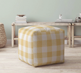 Classic upholstered yellow gingham pouf