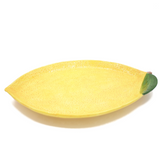 Ceramic lemon serving platter

Introducing the perfect addition to any dinner table or gathering, our lemon serving platter! This modern take on a timeless classic is just the touch of sophistication you need to bring your dinner setting to life. Handcrafted with ceramic and finished in a vibrant lemon yellow color, it brings a modern and contemporary statement to any dining room.

Materials:
Ceramic

Dimensions:
10 3/4" long x 1 1/4" deep x 16" wide

Care:
Hand-wash only