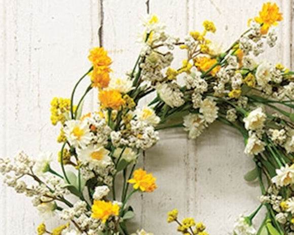 This candle ring is a decorative floral piece with a green-wrapped base. It is perfect to use as a candle ring around a larger pillar candle or as a miniature wreath. The ring as soft, foamy greenery and features cream and yellow astilbe buds alongside layered cream and yellow blooms. This ring brings a bright and cheerful touch to the home during the spring and seasons. They would also work well as wedding decorations.

Materials:
Foam, fabric, wire

Dimensions:
6 1/2