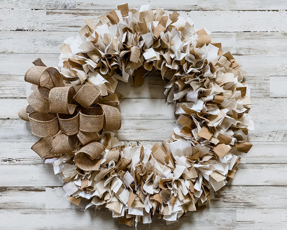 Brown and white polka dot hand-tied fabric wreath topped with burlap bow