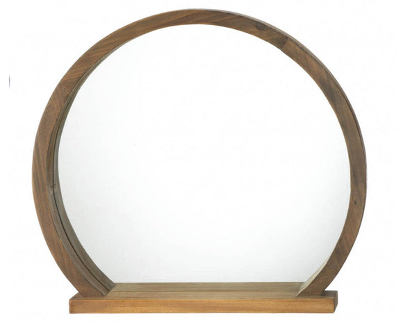 Brown wooden round wall hanging mirror with attached shelf on the bottom