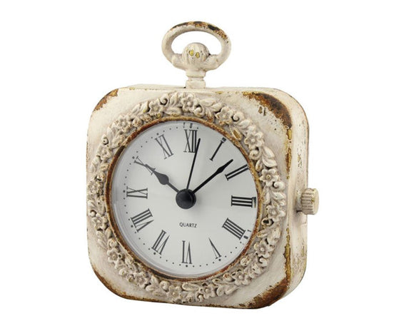 Small weathered white tabletop clock