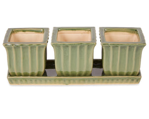 Square green ceramic planter display