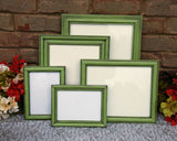 Green picture frames with black antiquing glaze