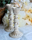 Small antique white ornate candlestick set