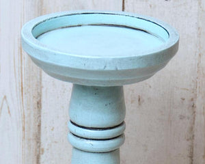  If you’re looking for farmhouse dining table decorations or shelf decor, look no further! These wooden candle holders complement almost any home or dining room decor. Place several of these candlesticks in a group on a dining room table for centerpiece or on a mantel in a living room for a vintage-inspired spring candlescape.

Sold individually, each candle holder is painted in a light blue and accented with a hand-rubbed black antiquing glaze to bring out its farmhouse style. It is then finished with clea