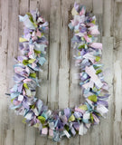 Add shabby cottage chic style to your space&nbsp;with this handmade fabric garland banner. Hang it on a mantel, on the front of a dessert table, or drape it around a high chair. It is perfect for spring! The possibilities are endless!

The garland is made using various raw-cut cotton fabric strips, satin ribbon, and lace strips that are tied onto a thick strand of twine. The overall length of the fabric portion of the garland ranges from 3 feet long to 10 feet long, with roughly 12" of additional twine on e