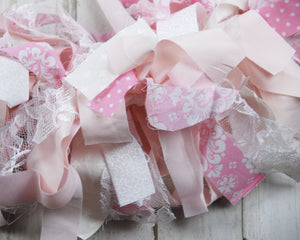 Add shabby cottage chic style to your spring decorations with these handmade fabric garland banners. Hang one on a mantel, on the front of an Easter dessert table, or string several along a stairwell for a dramatic statement piece. The possibilities are endless! 